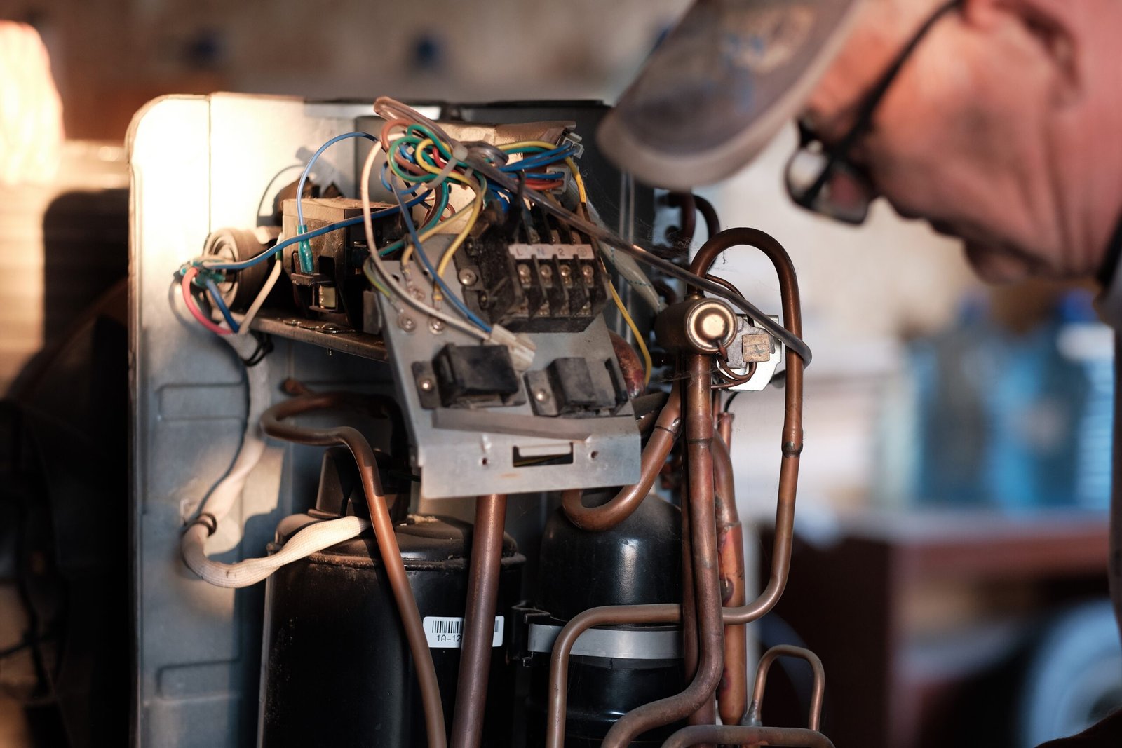 man-inspecting-complex-wiring-of-electronic-equipm-2026-03-20-01-04-51-utc